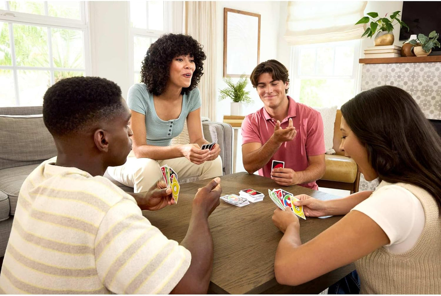 Friends playing Mattel UNO Add-On cards